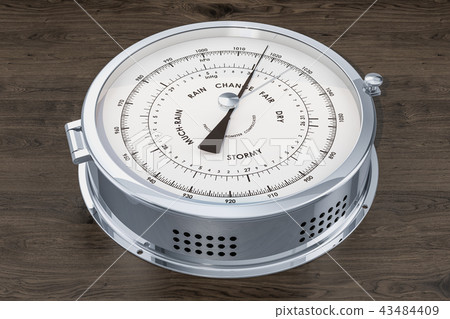 Barometer closeup on the wooden background 43484409