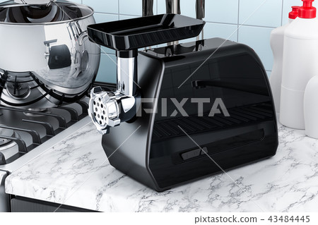Black electric meat grinder on the kitchen table 43484445