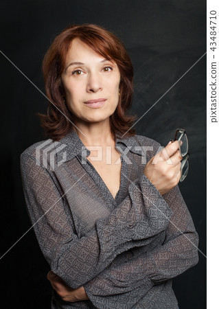 Beautiful mature woman with glasses, portrait 43484710