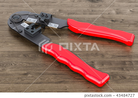 Crimper, crimp tool on the wooden table Crimper, crimp tool on the wooden table 43484727