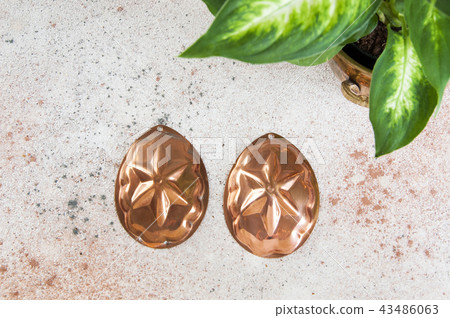 Vintage copper molds on a concrete background. Vintage copper molds on a concrete background. 43486063