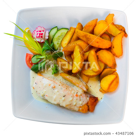 Photography of plate with salmon with sauce and potatoes 43487106