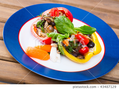 Peppers stuffed with forest mushrooms, rice, vegetables, greens 43487129