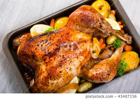 Roasted turkey with apples 43487156