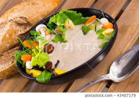 Mushroom cream soup with grain bread Mushroom cream soup with grain bread 43487179