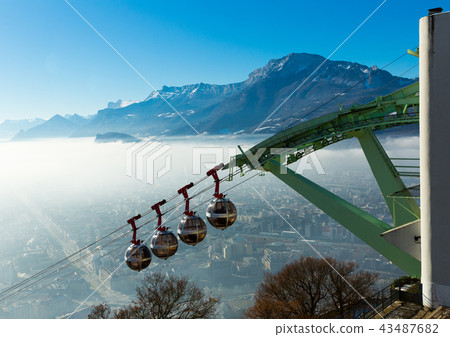 Cityscape with cable cars in Grenoble in autumn, France Cityscape with cable cars in Grenoble in autumn, France 43487682