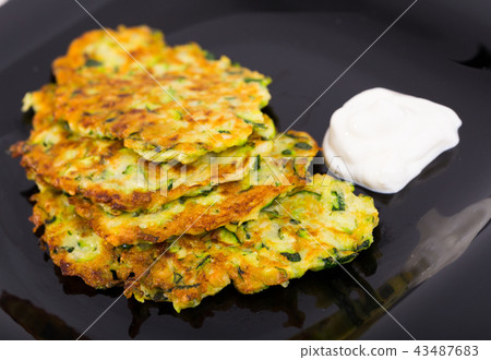 Pancakes from courgettes is tasty vegeterian dish 43487683