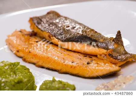 Grilled trout fillet with mashed broccoli Grilled trout fillet with mashed broccoli 43487860