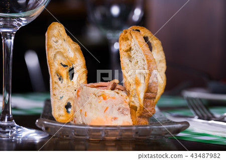 Image of plate with mousse and bread crisps on the table Image of plate with mousse and bread crisps on the table 43487982