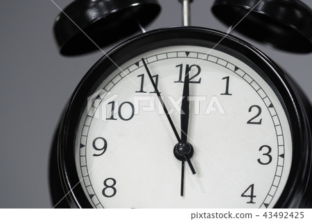 clock showing at noon clock showing at noon 43492425