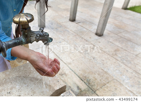 Spring pure transparent water is pouring  43499174