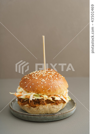 Homemade pulled pork burger on a plate Homemade pulled pork burger on a plate 43501469