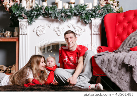 Mom, dad and little baby son . Loving family Merry Christmas and Happy New Year. Cheerful pretty 43501495