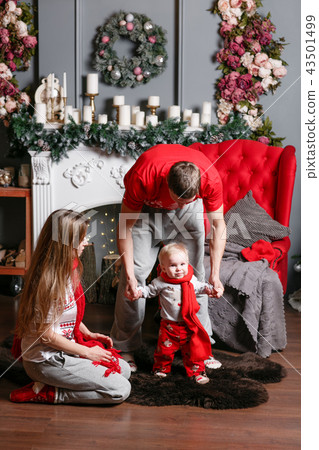 Loving family Merry Christmas and Happy New Year. Cheerful pretty people. Mom, dad and little baby 43501499