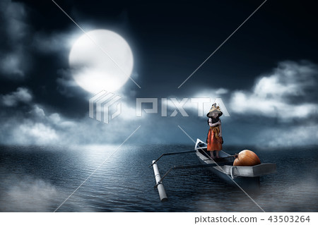 Little girl with witch costume and pumpkin 43503264