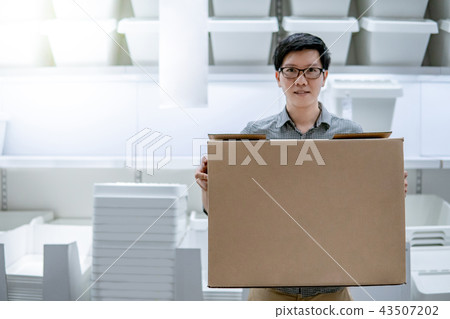 Asian man carrying box shopping in warehouse 43507202