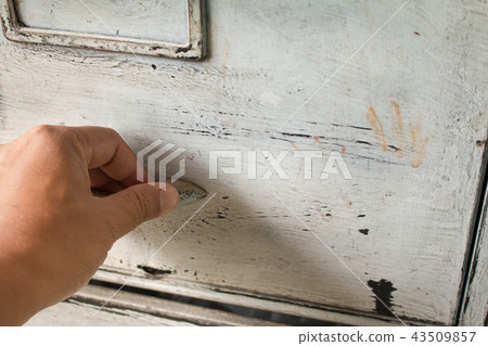 Soft focus of hand open drawer on poor lighting. Soft focus of hand open drawer on poor lighting. 43509857