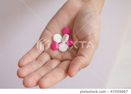 hand holding medicine pills. hand holding medicine pills. 43509867
