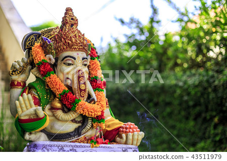 Ganesha with balinese Barong masks sitting on fron 43511979
