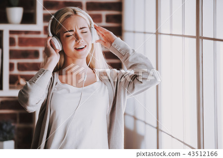 Young Smiling Woman Listening Music in Headphones 43512166