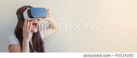 Woman using VR headset Woman using VR headset 43514205