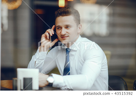 a businessman in a cafe a businessman in a cafe 43515392