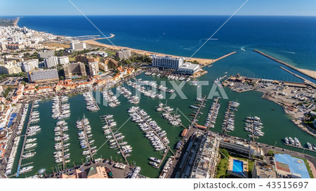 Aerial view of the bay of the marina, with luxury yachts in Vilamoura. Aerial view of the bay of the marina, with luxury yachts in Vilamoura. 43515697