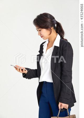 20s, 30s business woman walking on the phone while working, job, job, smartphone, phone, mobile, work 43524668