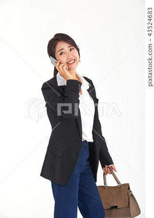 20s, 30s business woman walking on the phone while working, job, job, smartphone, phone, mobile, work 43524683