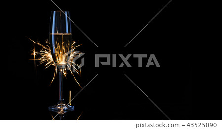 Tall glass of champagne with Bengal lights 43525090