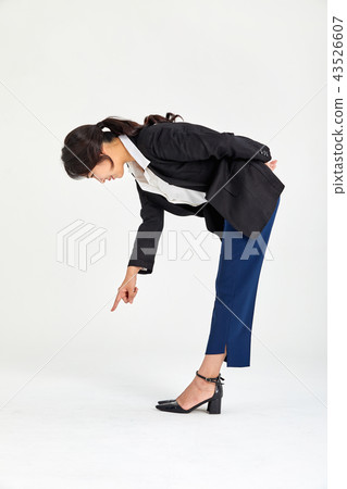 Twenty-year-old business woman wondering what is beneath her back, wondering 43526607