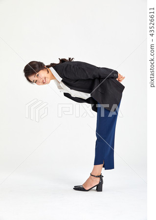 Twenty-year-old business woman wondering what is beneath her back, wondering 43526611