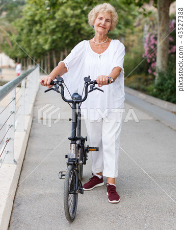 Elderly woman going to biking 43527388