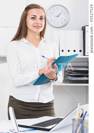 Young female is signing profitable financial agreement 43527524