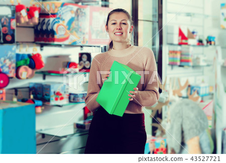 consumer with color box among children's toys 43527721
