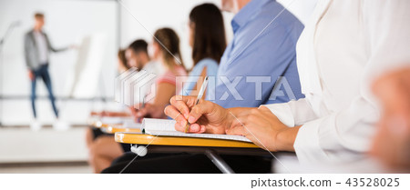 Female hand writing in notebook 43528025
