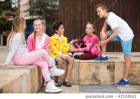 Company of children are communicating on walk Company of children are communicating on walk 43528081
