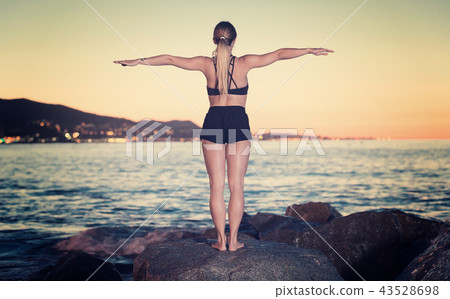 Female 24-31 years old is practicing stretching 43528698