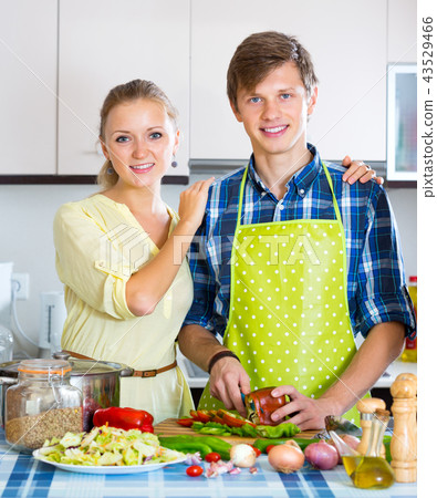 Young husband helping wife 43529466