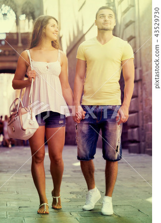 Couple walking through city Couple walking through city 43529730