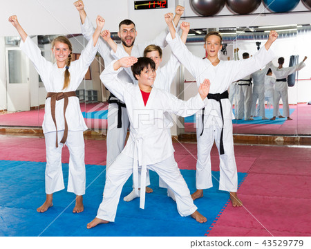 Happy kids karate group with coach 43529779