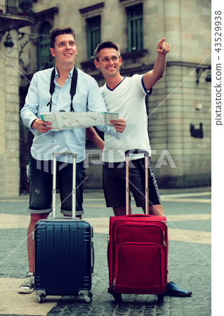 Male tourists with map and baggage 43529938