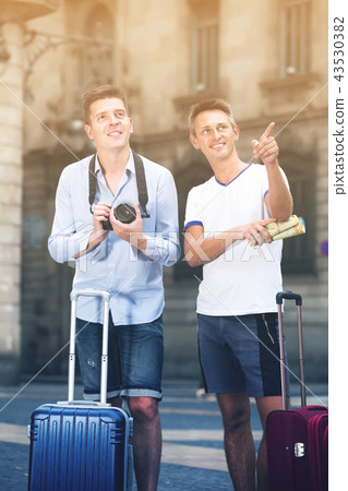 Traveling friends are walking around the European city 43530382