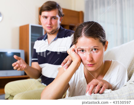 Unhappy woman trying reconcile with husband 43530597