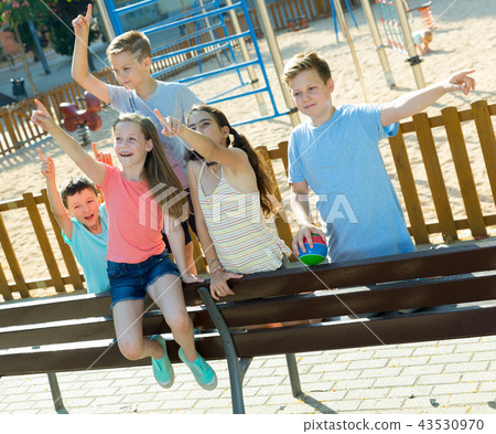 Five children point to something interesting Five children point to something interesting 43530970