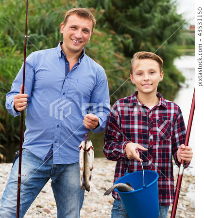 Family with catched fish 43531150