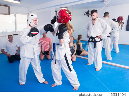 Man coach watches the sparring Man coach watches the sparring 43531404