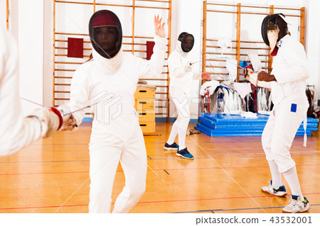 woman fencer practicing fencing combination woman fencer practicing fencing combination 43532001