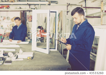 Workman showing PVC manufacturing output Workman showing PVC manufacturing output 43533260