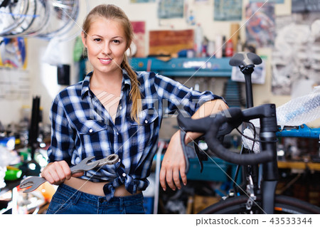 Portrait of girl who is working with instruments in workshop for Portrait of girl who is working with instruments in workshop for 43533344